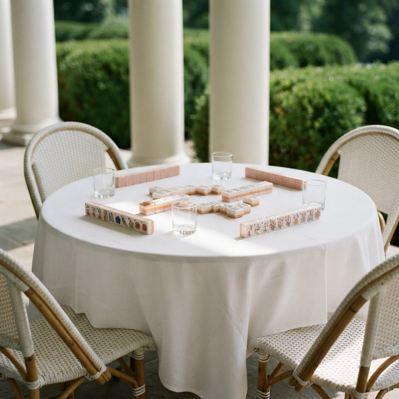 Blush Garden mahjong tiles set up on a terrace table