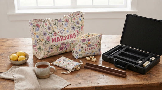 Four women at a fellowship hall table with a floral soft mahjong bag and a hard aluminum case