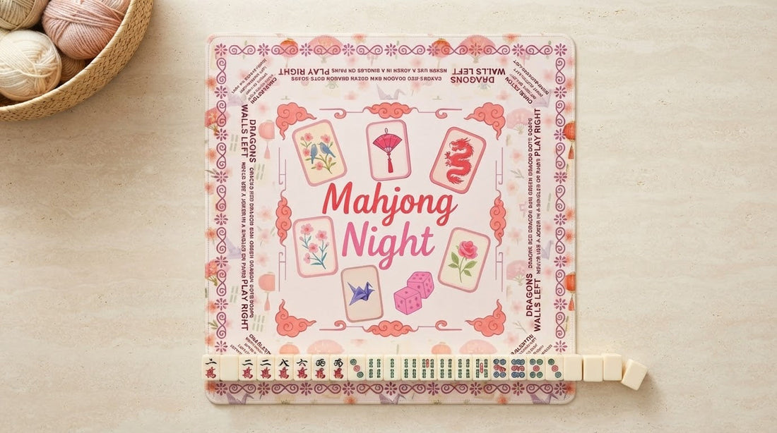 Four women shuffling mahjong tiles across a thick mat that keeps the clatter comfortably hushed