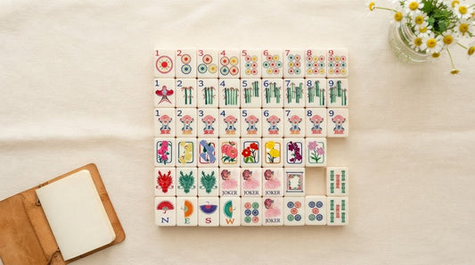 Newer player checking her tiles against a printed beginner's card at a church hall table
