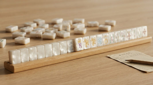 Woman consulting an official rule card mid-hand at a small hotel mahjong tournament table
