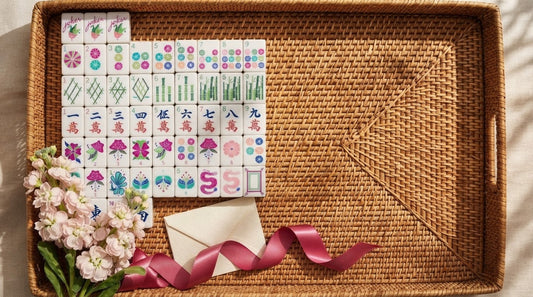 Four women admiring a beautifully boxed mahjong gift set at a spring Mother's Day gathering