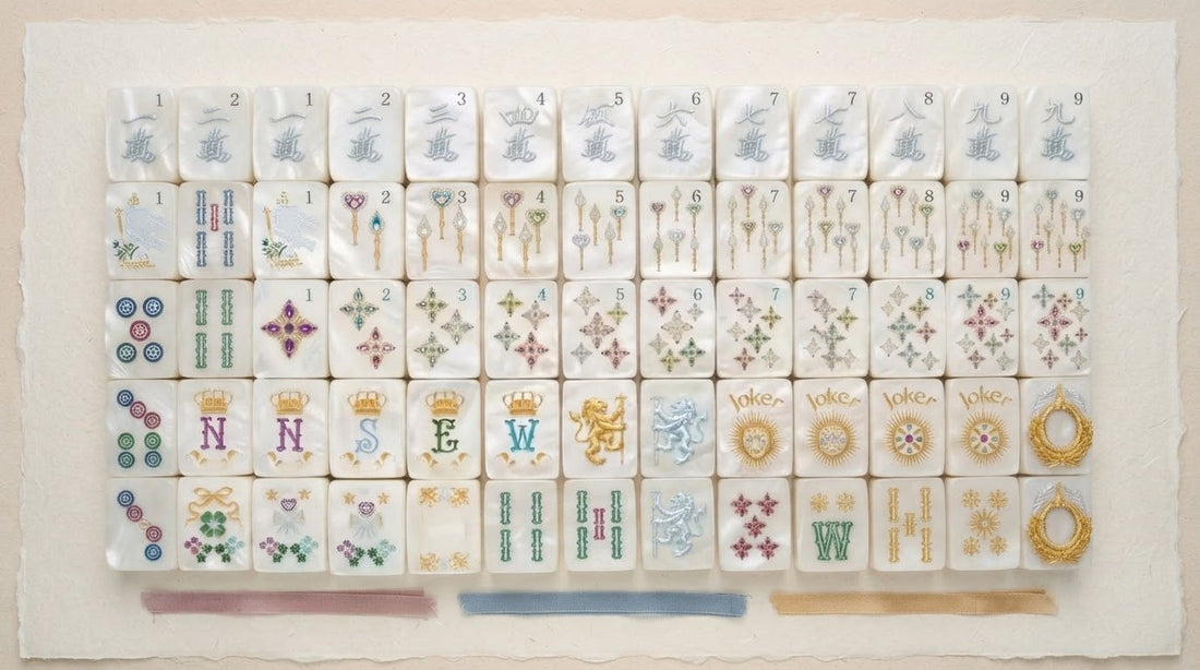 Four women comparing two color palettes of mahjong tiles at a sunlit senior center table