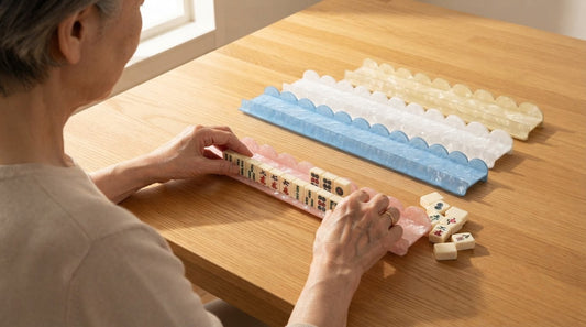Players lining their tiles into neat rows on the racks in a sunny apartment party room