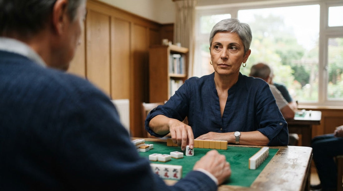 Four women at an alumnae club table, one keeping a neutral face as another tries to read her