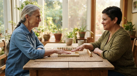 Four women resting hands on their racks in a garden clubhouse, ready to pass their tiles