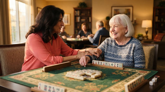 Four women applauding a winning mahjong hand in a rooftop lounge with tall glass walls