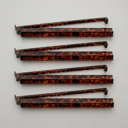 The Tortoise Shell Rack & Pusher Set — Warm Tortoise-Pattern Acrylic Racks with Built-In Pushers, So You Never Lean Across the Table