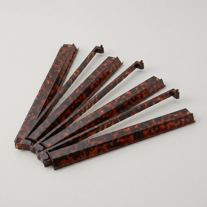 The Tortoise Shell Rack & Pusher Set — Warm Tortoise-Pattern Acrylic Racks with Built-In Pushers, So You Never Lean Across the Table