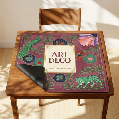 Art Deco Peacock mahjong mat with one corner folded back to show the black rubber underside