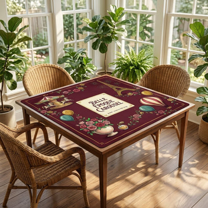Belle Époque Fairground mahjong mat on a card table in a sunroom with wicker chairs