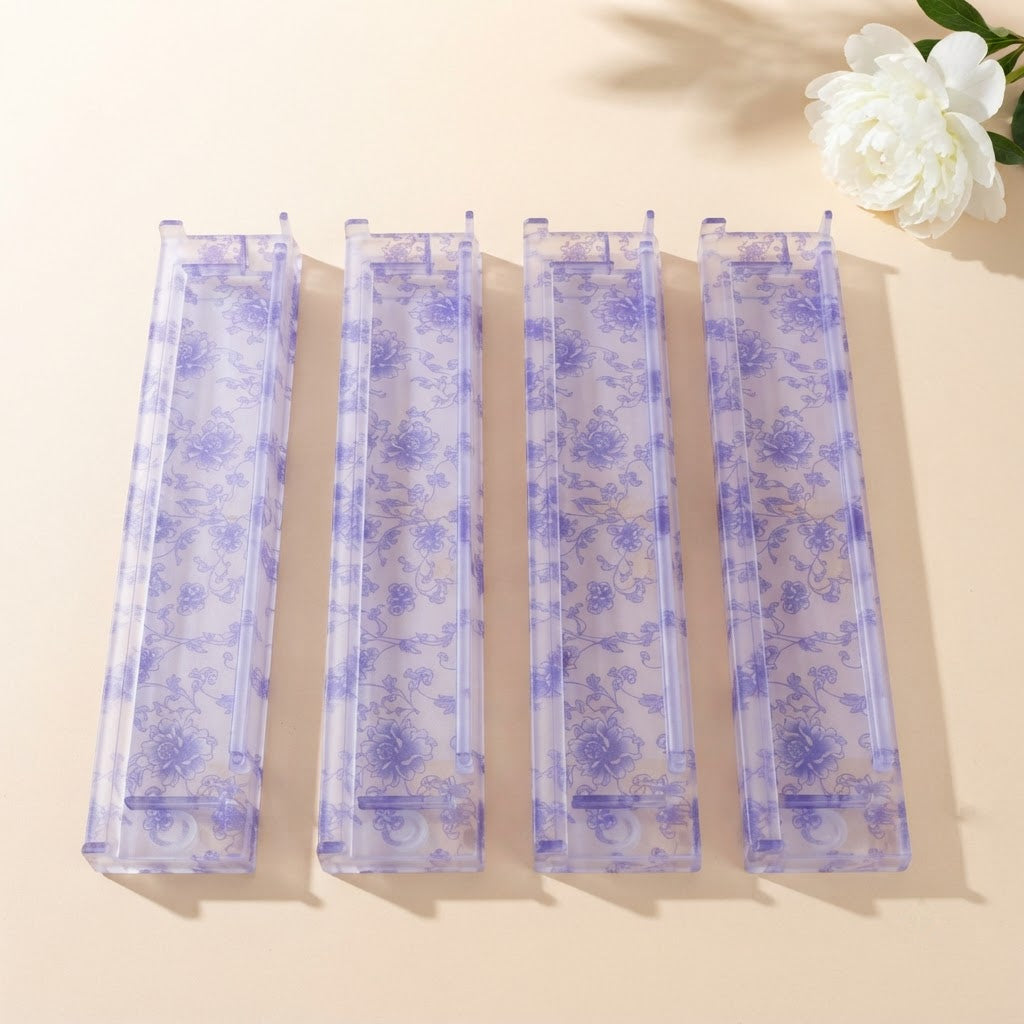 Four Blue Toile mahjong racks side by side from above beside a white peony