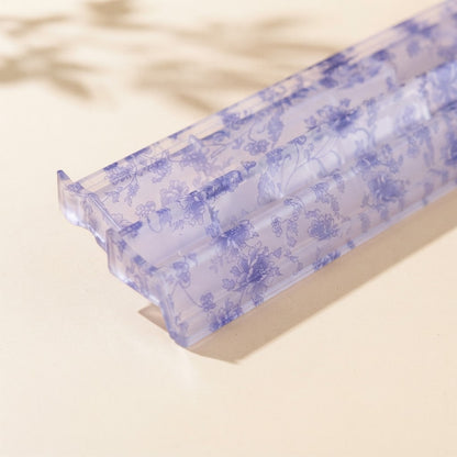 Close-up of the periwinkle-blue floral print on a Blue Toile mahjong rack