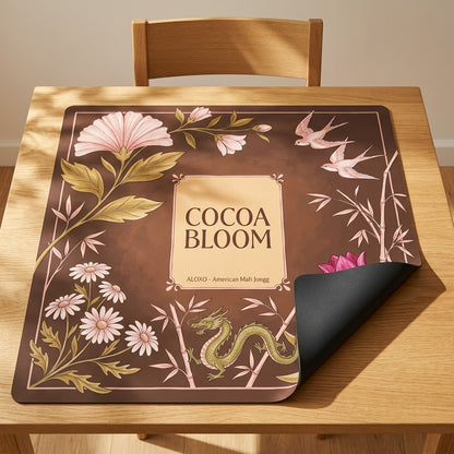 Blush Cocoa Bloom mahjong mat with one corner folded back to show the black rubber underside
