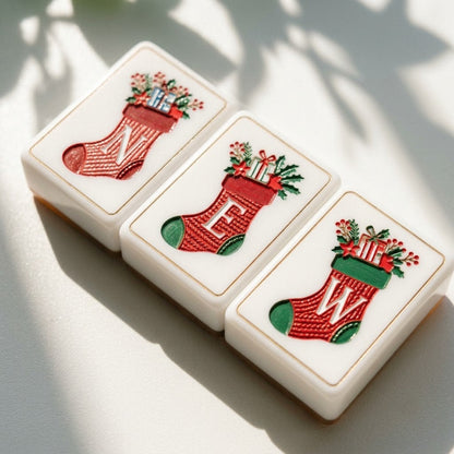 Macro of engraved Christmas Post wind tiles showing colour hand-filled inside the acrylic grooves