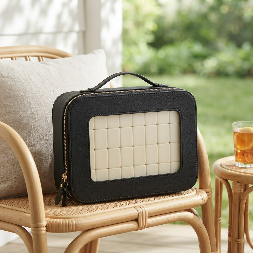 Black Clear Window mahjong case on a rattan porch chair