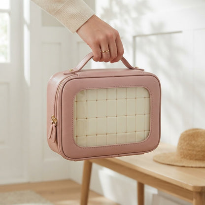 Hand carrying the pink Clear Window mahjong case by its top handle