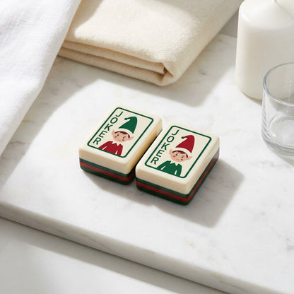 Close-up of two elf Joker tiles, red and green
