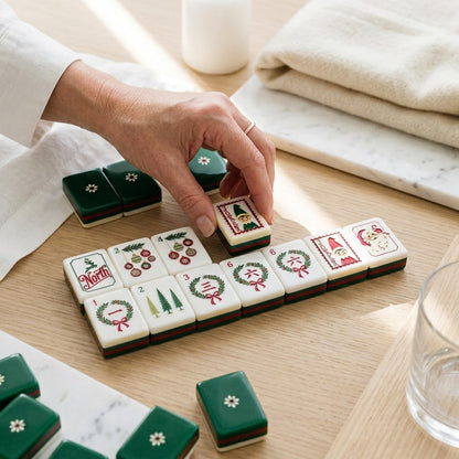 A hand setting a tile down