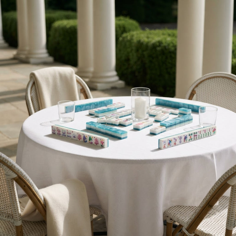 Flamingo Lagoon mahjong tiles set up on a terrace table