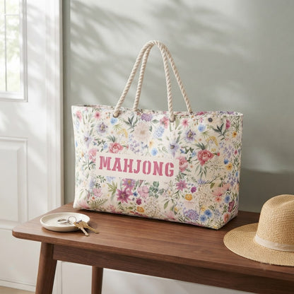 The tote of the floral Mahjong travel bag set on an entry bench by the front door