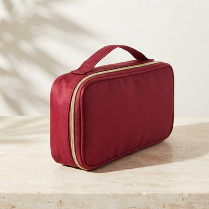 Red rack pouch with a gold-tone zip and top handle