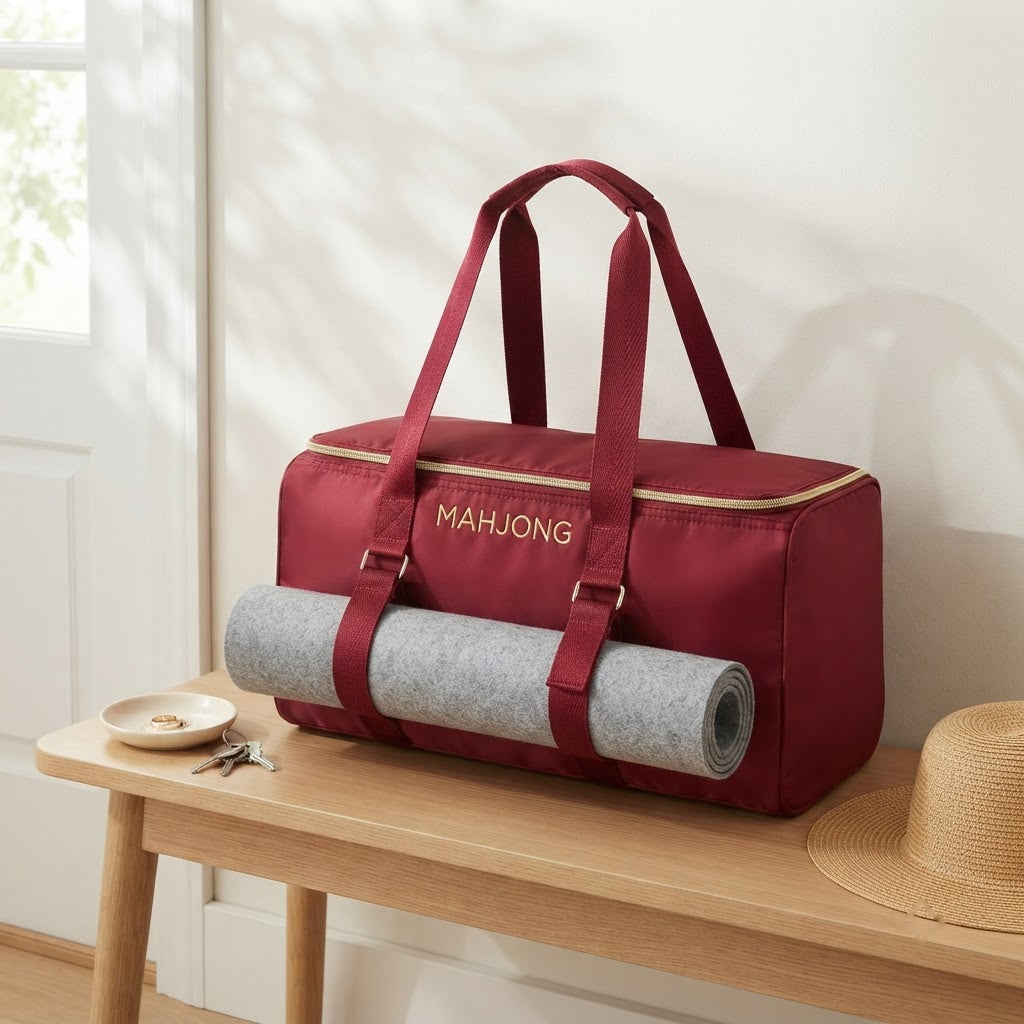 Red mahjong duffel on an entry bench by the front door