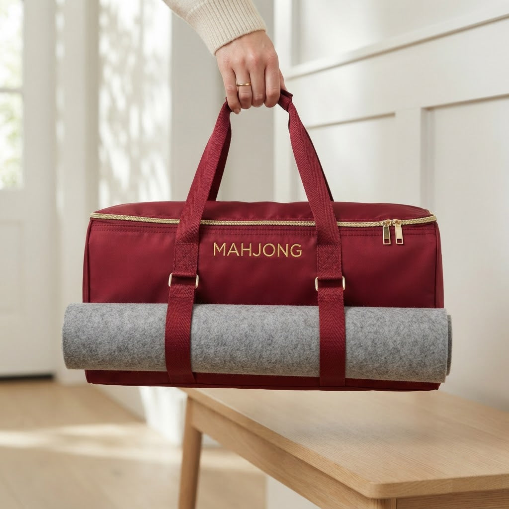 Hand carrying the red mahjong duffel