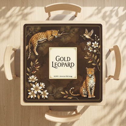 Golden Leopard Grove mahjong mat on a square card table with four chairs, seen from above