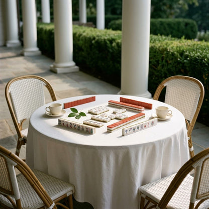 The set laid out on a white linen cloth on a sunlit country-club terrace