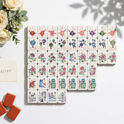 The full Grand Tour set laid out in a stepped block of six rows on bright white, with terracotta-backed tiles stacked at the edge