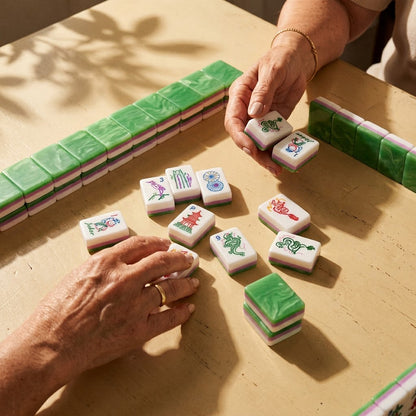 Racked line of Jade Marble tiles mid-game with a hand reaching in