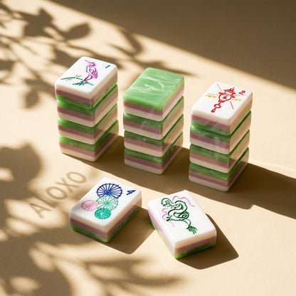 Stacks of Jade Marble tiles showing three layers — white, pink and jade green