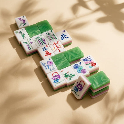 Loose cluster of Jade Marble tiles in warm dappled sunlight