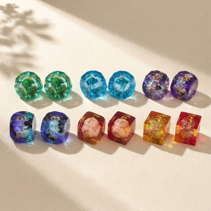Six styles of resin mahjong dice pairs arranged in two rows on a cream surface