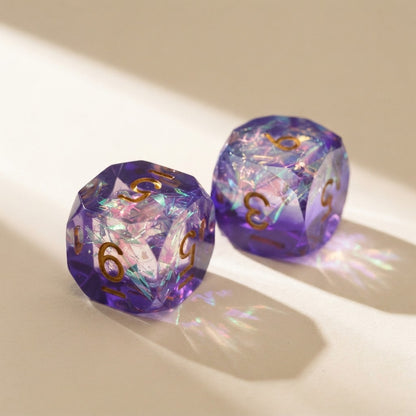 Close-up of two purple iridescent resin mahjong dice