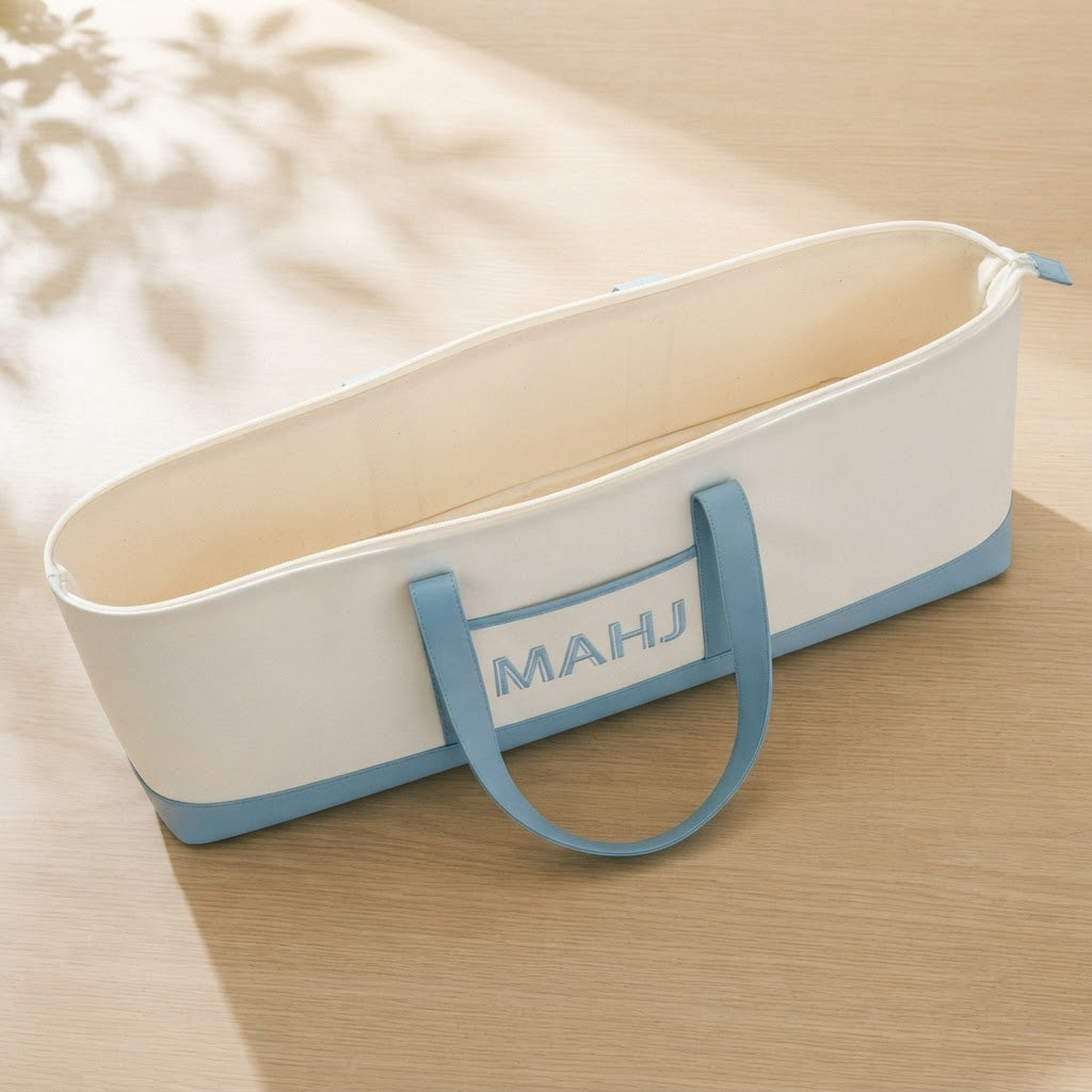 Long mahjong tote open from above showing the cream lining