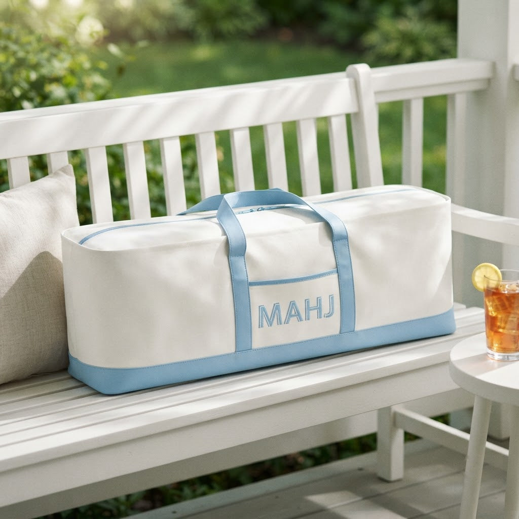 Long mahjong tote on a white porch bench