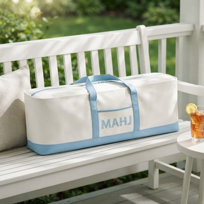 Long mahjong tote on a white porch bench