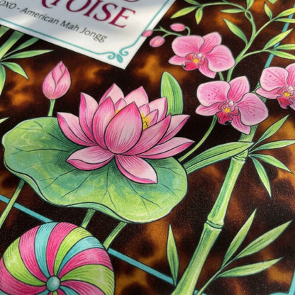 Close-up of the printed artwork on the Lotus Stripe & Tortoise mahjong mat