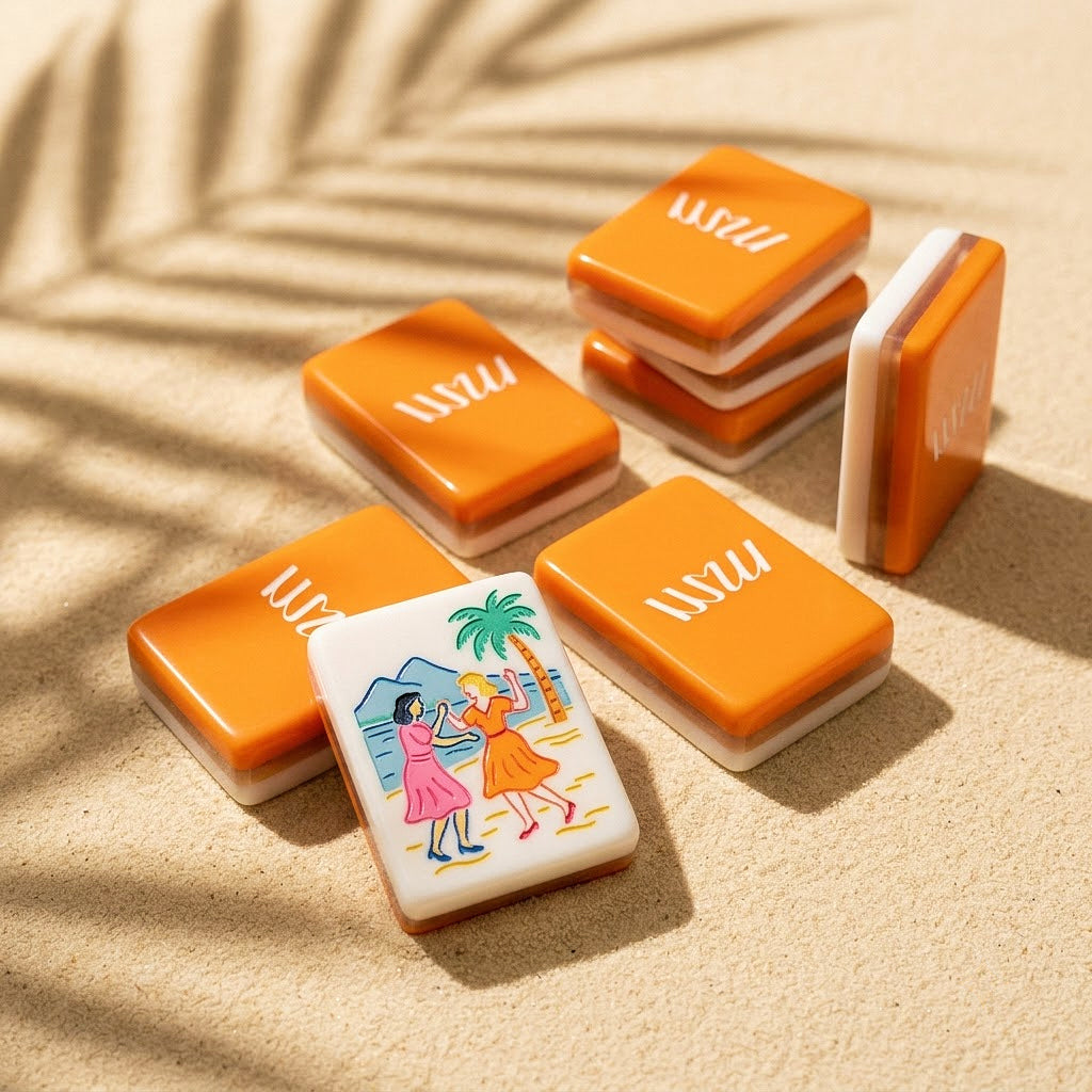 Tangerine orange tile backs with white script mark, beside ivory faces