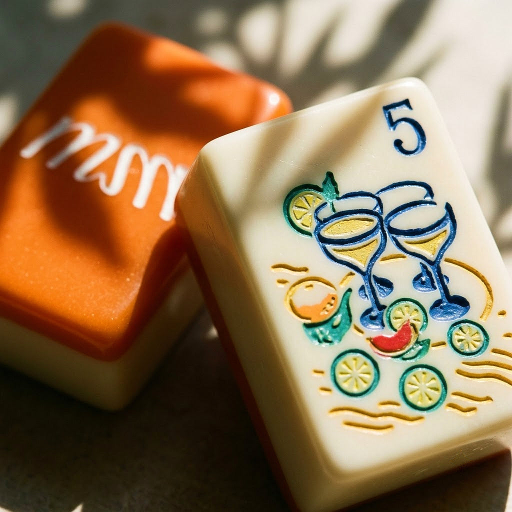 Macro detail of an engraved margarita glass tile and a tangerine back