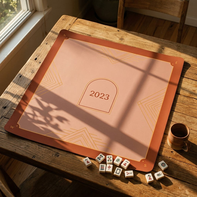 Terracotta custom mahjong mat marked with the year the group started playing