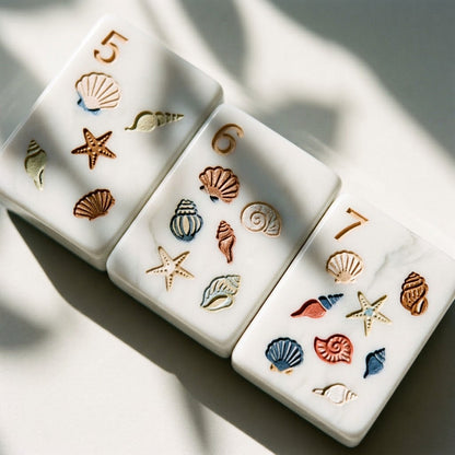 Macro of engraved Nantucket Shore shell tiles showing colour hand-filled inside the acrylic grooves