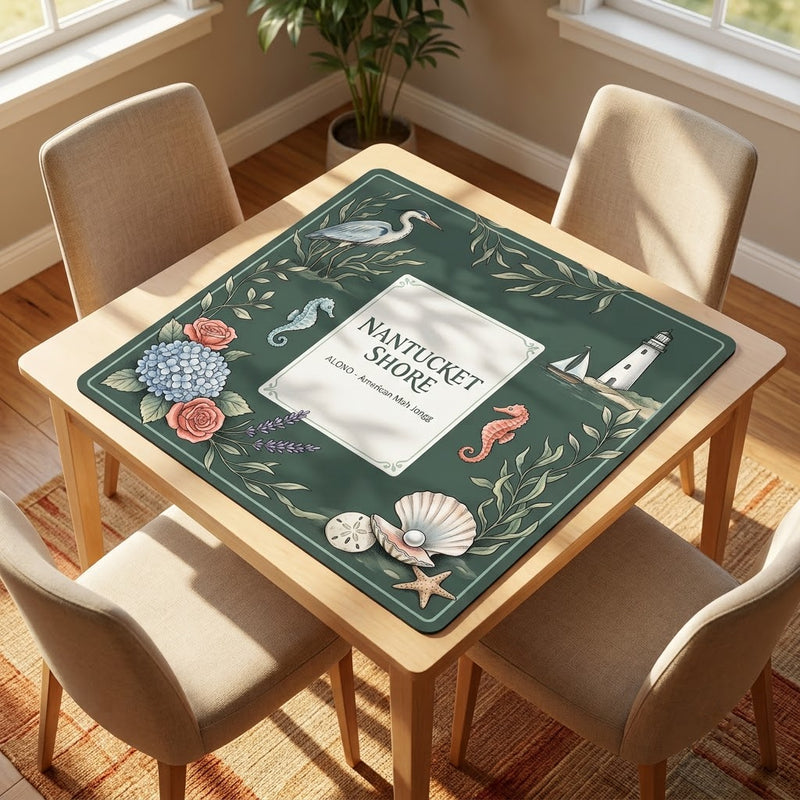 Nantucket Lighthouse Shore mahjong mat on a card table with four chairs in a living room