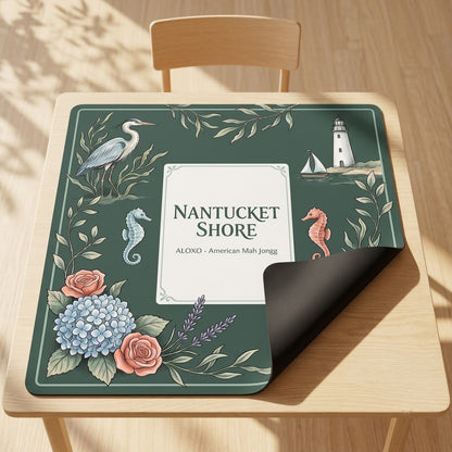 Nantucket Lighthouse Shore mahjong mat with one corner folded back to show the black rubber underside
