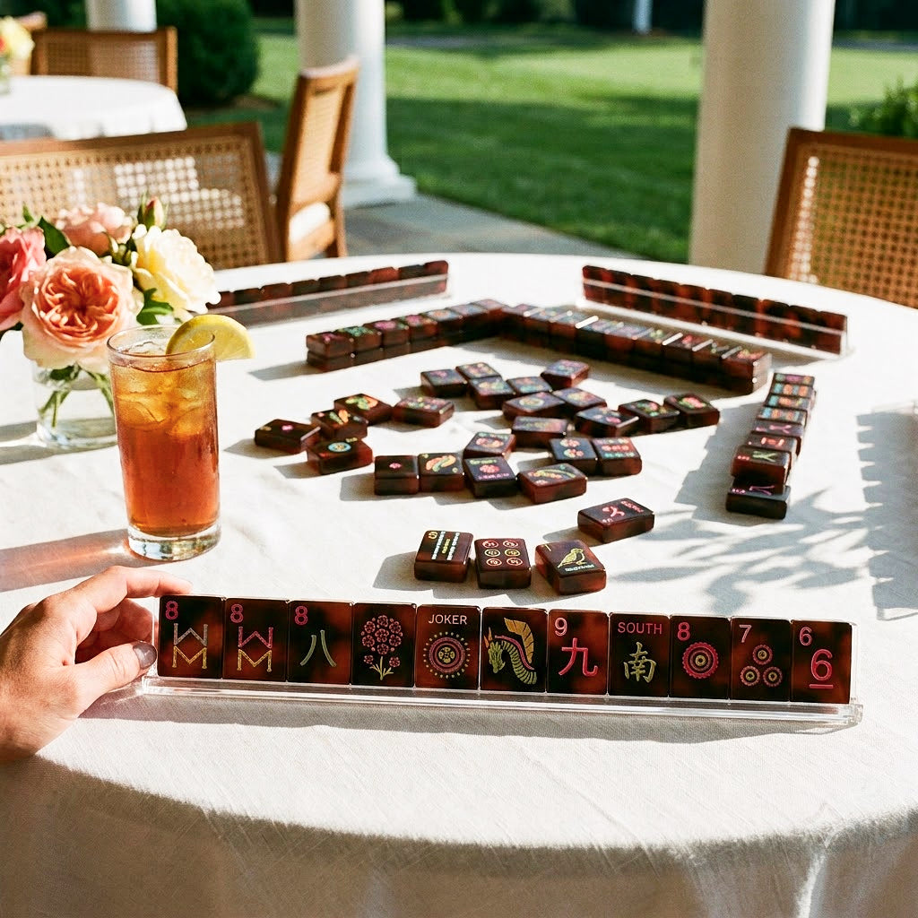 Mahjong tiles set out on a linen covered table on a sunny club terrace