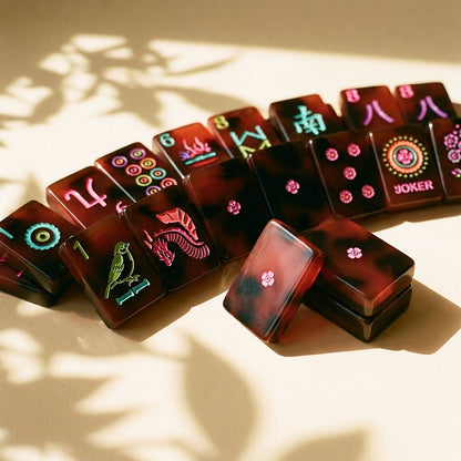 Dragon, wind and flower tiles arranged in a row on a cream surface