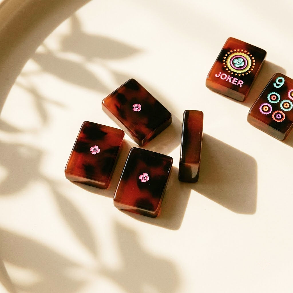Tile backs with pink blossom motif and polished tortoiseshell edges