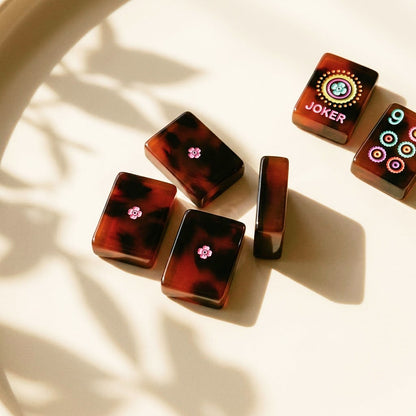 Tile backs with pink blossom motif and polished tortoiseshell edges